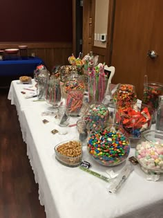 the table is covered with candy and candies