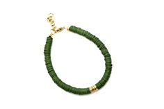 An olive green heishi bead bracelet is the perfect on-trend accessory to top off your look. It is a great stand alone bracelet and works well as a stack bracelet, too. This non-stretch bracelet features olive green polymer clay heishi beads with gold brushed metal beads in the center, all hand-strung onto flexible jewelry wire. The bracelet is finished off with a lobster clasp, and a 1" extender chain to accommodate various wrist sizes. MATERIALS Polymer Clay & Metal Beads SIZE 6 1/2" Extendable Green Heishi Bead Jewelry Bracelet, Green Heishi Beads Bracelet, Heishi Bead Bracelet, Stack Bracelet, Green Bracelet, Jewelry Wire, Heishi Beads, Brushed Metal, Bracelet Stack