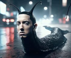 a man with horns on his head is laying in the street and staring at something