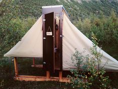 a tent is set up in the woods