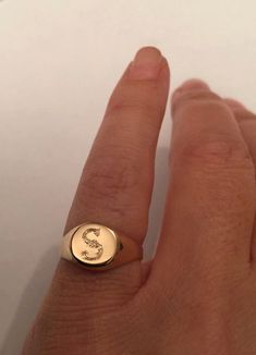 "Pinky ring, Engraved ring, Initial Ring, Personalized Ring Engraved Signet ring with Round Seal- Best quality 18k Gold Plate Engraved 1 letter - Vintage style Diameter: 0.7 mm = 0.27\" Please note in the \"notes to seller\" at checkout. : * state your ring size * letter you want to apper The product will arrive to you packed in gift box and padded envelope to maintain the product Our jewelry are water resistant and comes with 1 year warranty Thank you for your interest. Please check out our oth Formal Rings With Si Clarity, Round Shape, Elegant Rings With Initials On Round Band, Elegant Ring With Initials On Round Band, Elegant Round Band Ring With Initials, Yellow Gold Rings With Si Clarity And Round Cut, Vintage Jewelry With Initials For Promise Ring, Adjustable Initial Ring With Polished Finish For Wedding, Classic Ring Jewelry With Initials, Personalized 14k Gold Initial Ring With Round Band