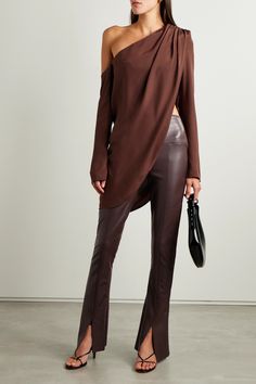 Norma Kamali's 'Spat' leggings have dramatically flared hems emphasized by splits and a structured lining. Made from stretchy vegan leather, they're cut with a high-rise waist and fit slim through the legs. Style yours with a chunky sweater and point-toe pumps. Affordable Chic Leather Pants For Party, Flare Leather Pant, Elegant Leather Pants, Luxury Leather Wide Leg Bottoms, Leather Pants Women Dressy, Dinner Date Leather Pants, Date Night Leather Pants, Leather Pants Off The Shoulder Top, Banana Republic Leather Pants