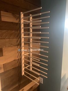 a wooden shelf with many clothes pins on it