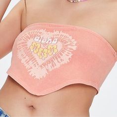 A Knit Tube Top Featuring Front "Aloha" Text, Heart And Floral Graphics, A Straight-Cut Neckline, And Cropped Pointed Hem. Content + Care - 100% Cotton - Machine Wash Cold Size + Fit - Model Is 5'8" And Wearing A Small Trendy Cotton Tube Top For The Beach, Casual Tube Top For Vacation, Casual Tube Top For Beach Season, Trendy Crop Top Tube Top For Vacation, Trendy Bandeau Beach Top, Trendy Bandeau Top For Beach, Trendy Bandeau Tops For Beach Season, Casual Stretch Tube Top For Beach Season, Casual Stretch Tube Top For Vacation