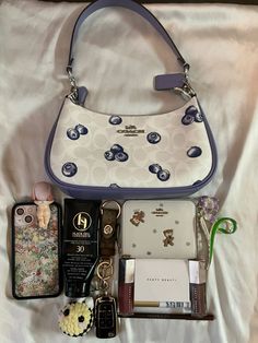 (Follow for more) From: niaesperanzaa on tt & IG  Heres a small whats in my bag #coach #bag #purses #bagsandpurses #whatsinmybag #wildflower #fenty coach bags purses essentials fenty coach fruit collection Coach Bag Collection, Purses Essentials, Coach Bags Aesthetic, Purses Aesthetic, Purse Necessities, Coach Bag Outfit