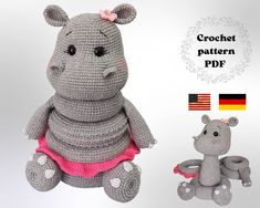 a crocheted hippo is sitting next to a stuffed animal with a pink dress