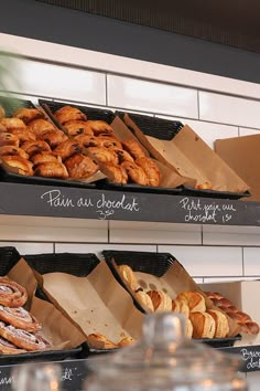 there are many different types of pastries on the shelves