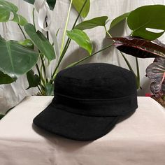 Discover timeless elegance with our Black Winter Cadet Cap, a masterpiece meticulously handcrafted from premium wool blend fabric. Embrace the season in style and warmth with this military-inspired hat, tailored to keep you cozy and fashionable. The deep, sophisticated shade of black adds a touch of refinement to any winter ensemble. Its adjustable back strap ensures a perfect fit for head sizes ranging from 56-62cm, providing both comfort and confidence in your style. Inspired by iconic figures Casual Black Flat Cap Felt Hat, Adjustable Winter Flat Cap, Classic Wool Hat, Classic Felt Cap For Winter, Classic Winter Felt Cap, Fitted Wool Cap, Black Felt Cap For Winter, Black Winter Felt Hat, Fitted Wool Flat Cap