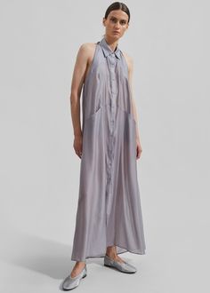 Temi Sheer Halter Dress - Grey Sheer Sleeveless Silk Maxi Dress, Sleeveless Sheer Silk Maxi Dress, Summer Silk Midi Shirt Dress, Silk Midi Shirt Dress For Summer, Silk Button-up Dresses For Daywear, Sleeveless Button Closure Shirt Dress For Daywear, Chic Sleeveless Shirt Dress For Casual Occasions, Sleeveless Buttoned Shirt Dress For Daywear, Sleeveless Buttoned Maxi Dress For Daywear