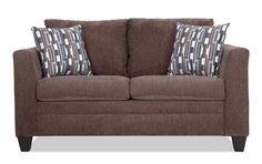 a brown couch with two pillows on it