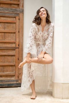 Feminine Lace Gown With Delicate Details, Delicate Lace Gown For Ceremonies, Ceremony Gown With Delicate Lace, Feminine Lace Bodice Gown, Feminine Lace Gown With Lace Bodice, Feminine Lace Gown With Lace Trim, Lace Dress With Lace Cuffs For Wedding Night, Lace Wedding Night Robe With Lace Sleeves, Delicate Lace Robe For Wedding Night