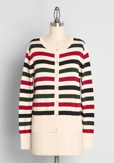 Covered throughout in broad horizontal stripes of contrasting black, red, and green, this ivory-hued cardigan is unexpectedly festive for the holiday season, and stylish enough to be worn year-round ! Made from a stretchy cotton knit, this button-up sweater boasts long sleeves, and ribbed-knit detailing at the ivory cuffs, collar, and hemline. Cotton. Machine wash. Front button closure. Imported Fabric provides stretch. S=21 inches Length 1X=23 inches Length | Circus Of A Different Stripe Cardig Plus Size Christmas Tops, Vintage Style Swimwear, Designer Plus Size Clothing, Casual Dresses Plus Size, Stripe Cardigan, Christmas Outfits Women, Midi Dress Plus Size, Christmas Sweaters For Women, White Stripes Shirt