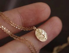 Dainty and elegant small oval necklace, nature-inspired leaf pendant necklace made in solid gold * Pendant material: 10K Yellow Gold * Pendant size: 9.5x7mm * Necklace material: 14K Yellow Gold * Necklace length: 16.5" * Stamp: 10K ❤️Visit our official website for exclusive new products.      https://elekalonjewelry.com/ ❤️Follow us on Instagram @ elekalonjewelry for the latest projects and much more! ❤️If you have any questions, please feel free to message us. Nature-inspired Gold Necklace With Oval Pendant, Plant Necklace, Necklace Minimalist Jewelry, Necklace Leaf, Gold Leaf Necklace, Delicate Pendant, Jewelry Delicate, 14k Yellow Gold Necklace, Oval Necklace