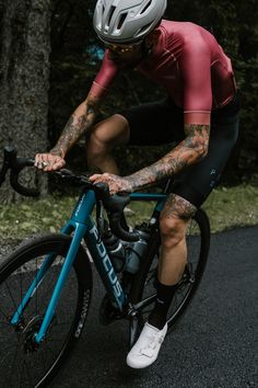 a man riding a bike down a street