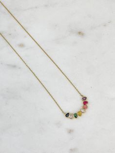 This pendant necklace features stunning rainbow stones, adding a playful and eye-catching touch to any outfit. Made with expertly cut cubic zirconia, it offers a brilliant and vibrant sparkle. Elevate your look with this beautiful and unique piece. Gold Dipped 15.5"-17.5" Chain Multi-stone Diamond Necklace Gift, Rainbow Cubic Zirconia Jewelry With Sparkling Stones, Rainbow Cubic Zirconia Jewelry As Gift, Rainbow Cubic Zirconia Necklaces As Gift, Rainbow Cubic Zirconia Necklaces For Gift, Rainbow Cubic Zirconia Necklace For Gift, Multicolor Cubic Zirconia Pendant Necklace, Rainbow Multi-stone Cubic Zirconia Jewelry, Stone Pendant Necklace