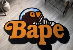 an area rug with the word bape on it