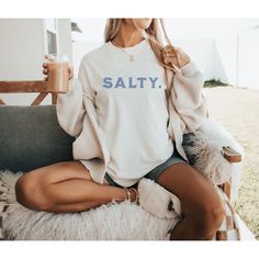 Wrap yourself up in cozy comfort with this oversized funny beach shirt. This salty shirt features retro vintage-inspired font perfect for adding a touch of  beachlife charm to any outfit. This shirt is versatile enough to wear for both casual and dressed-up occasions. This shirt is the perfect gift for your summer vacation, Mother's Day, birthday's, anniversary, Christmas, or whatever the occasion. *Adult Unisex Tshirt *Comfort Colors 1717 *Ivory Color Design: The vintage-inspired design of the Trendy Long Sleeve T-shirt For Beach, Relaxed Fit Long Sleeve Beach T-shirt, Casual Long Sleeve T-shirt For Vacation, Oversized Vacation Shirt With Letter Print, Oversized Letter Print Shirt For Vacation, Casual Shirt With Graphic Print For Loungewear, Oversized Casual Shirt With Funny Print, Casual Beach Season Tops, Casual Beach Season Tops For Leisure