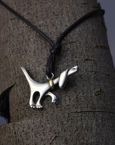 Penguin is the name of this pendant inspired by a dog that accompanied me for many years. It is made of 925 silver and the necklace is made of brass. It has dimensions of 40x 25mm and a weight of 5.30 grams which make it solid and durable. It has a textile cord with silver finishes, the length of the cord is 45cm but can be modified to suit the buyer. It is handmade and signed on the back by the creator Raquel Pau. The pieces are carved in wax and then melted I have always had a great empathy to Penguins, Silver Fashion, 925 Silver, Jewelry Necklace Pendant, Wax, Handmade Items, Textiles, Brass, Jewelry Necklaces