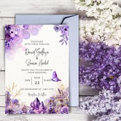 purple flowers and butterflies are featured in this wedding card