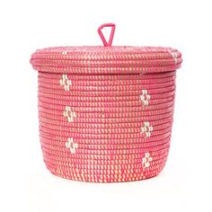 a pink basket with white and red designs on the lid is sitting in front of a white background