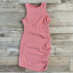 Adorable Dress With Ruching On One Side. This Has A Button And Loop Closure On The Back At The Neck. This Is 44% Cotton, 1% Elastane And 55% Polyester. Measurements: Pit To Pit- 15” Shoulder To Hem- (Left Side) 30.5” (Right Side) 33” Pit To Hem- (Left Side) 21.5” (Right Side) 24” Casual Gingham Dress With Ruched Details, Ruched Mini Dress For Picnic, Casual Ruched Gingham Dress, Casual Ruched Dress For Picnic, Ruched Mini Dress For Picnics, Red Knee-length Dress For Picnic, Casual Red Plaid Dress For Spring, Sleeveless Gingham Dress With Ruched Detail, Sleeveless Gingham Ruched Dress