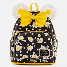 Get Ready For Spring With The Minnie Mouse Daisy Mini Backpack! The White Daisies And Polka Dots Stand Out Against The Black Background, Adding A Bright Yellow Zest To Spring Or Even Summer Outfits. Between The Daisy Covered Ears Is A Bright Yellow Bow, Tying Together The Whole Look. This Bag Will Help You Brighten The New Year! The Loungefly Minnie Mouse Daisy Mini Backpack Is Made Of Vegan Leather (Polyurethane). Bag Has Adjustable Shoulder Straps, Sturdy Metal Hardware, And Features: Applique Disney Bags Backpacks, Minnie Mouse Backpack, Cute Mini Backpacks, Mini Mochila, Faux Leather Backpack, Loungefly Bag, Disney Bag, Loungefly Disney, Minnie Ears