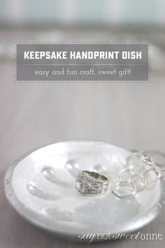 two wedding rings on a plate with the words keepsake handprint dish easy and fun craft, sweet gift