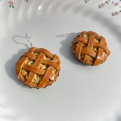 two small pieces of pie sitting on top of a white plate next to each other