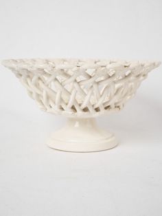 This elegant openwork ceramic fruit basket dates from the early twentieth century and is branded Pichon Uzes underneath. Note the little flowers that finish the lattice patterned basket and the elegant flared pedestal foot. It is in excellent condition for its age. A second larger bowl is also available for separate purchase. Light wear.Approx. overall 4¼" high x 8" diameter Approx. overall 11cm high x 20cm diameter Fireplace Baskets, Accent Table Decor, Outdoor Lantern Lighting, Small Ceramic Bowl, Mirror Paint, Ceramic Fruit, Trumeau Mirror, Basket Bowl, Lantern Pendant Lighting