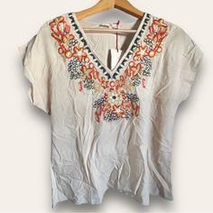 Solitaire Women’s Embroidered Blouse Top Beige Khaki Small New Condition: New With Tag Size: Small Color: Beige/Khaki Approx Measurements Bust: 20” Length: 26” Multicolor Floral Embroidered V-neck Top, V-neck Blouse With Multicolor Embroidery For Vacation, Multicolor Embroidered V-neck Top For Vacation, Embroidered Beige Blouse For Summer, Summer Embroidered Beige Blouse, Summer Beige Blouse With Floral Embroidery, Beige Blouse With Floral Embroidery For Summer, Beige Short Sleeve Tops With Floral Embroidery, V-neck Vacation Tops With Embroidered Hem