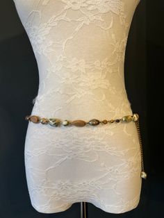 High quality metal chain & Marble Bead belt.  Exclusively designed by FAN Design, this belt is made to a wide range of sizes. Matching necklace also available.  Choose your waist size in inches, all belts will come with an extra 12 inch hanging chain Tap into the hottest new trend with chain belts! This chic piece of bodywear can be draped over your clothing to enhance your outfit or worn with bare midriff looks. Pair it with a simple black ensemble for an elegant finish. Perfect accessory for a Bohemian Beaded Waist Chain, Bohemian Style Adjustable Chain Belt, Bohemian Adjustable Chain Belt, Bead Belt, Elegant Swimwear, Beads Fashion, Belt Vintage, Chain Belts, Beaded Belt