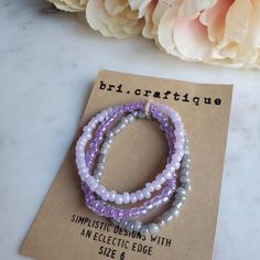 Perfect for the purple lover in your life, this stretch seed bead set delivers all the lavender vibes. Lilacs and iridescence create the perfect combo for all your pastel dreams. (Bracelet sold as a set)Size shown: 7 inches Strung on pre-stretched bracelet material. SIZINGThe sizing chart is the standard for stretch bracelets. Since material is pre-stretched there is some leeway or give as far as how the bracelet fits on your wrist. TIP FOR MEASURING: Best rule of thumb when measuring your wrist Trendy Purple Jewelry With Tiny Beads, Trendy Purple Jewelry With Spacer Beads, Lavender Beaded Bracelets With Round Beads As Gift, Adjustable Lavender Bracelets With Spacer Beads, Lavender Bracelets With Tiny Beads For Gift, Purple Stretch Bracelet With Tiny Beads As Gift, Bohemian Purple Stretch Bracelet With Faceted Beads, Trendy Purple Beads For Gifts, Lavender Beaded Bracelet With Tiny Beads For Gifts