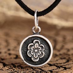 Relive the spring in the Armenian region with this gorgeous accessory by Tsolak Koshtoyan. As an expert in silversmithing techniques, the artisan uses sterling silver to create this necklace, whose pendant in the shape of a cute flower dangles from a faux leather cord. As the final touch, the piece features a combination of polished and oxidized finishes. Handmade Antique Silver Flower Pendant Jewelry, Silver Oxidized Flower Pendant Jewelry, Silver Bohemian Charm Necklace As Gift, Spiritual Oxidized Flower Pendant Jewelry, Bohemian Sterling Silver Charm Necklaces In Silver, Silver Jewelry With Oxidized Finish And Flower Pendant, Sterling Silver Flower Pendant With Oxidized Finish, Bohemian Silver Charm Necklace As Gift, Nickel-free Sterling Silver Flower Pendant Necklace