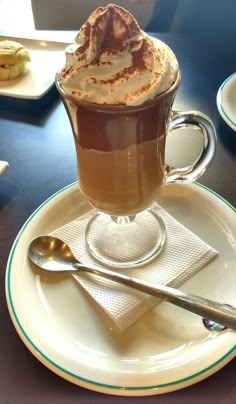 a cup of hot chocolate with whipped cream on top