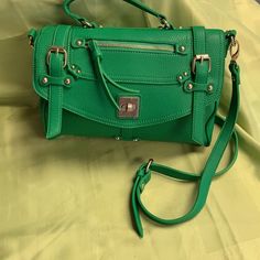 Detachable Shoulder Strap Converts To Handbag. Gold Tone Hardware. Trendy Green Satchel For Travel, Trendy Satchel With Fold Over Clasp For Daily Use, Trendy Daily Use Satchel With Fold Over Clasp, Green Crossbody Satchel With Zipper Closure, Green Flap Satchel For Everyday Use, Green Satchel Backpack With Detachable Strap, Everyday Green Flap Satchel, Chic Green Satchel With Hasp Closure, Green Satchel With Adjustable Strap For On-the-go