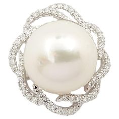 South Sea Pearl with Diamond 0.50 carat Pendant set in 18K White Gold Settings (chain not included) Width: 2.0 cm Length: 2.0 cm Total Weight: 6.4 grams South Sea Pearl Approximately: 14 mm "We first opened doors in 1980 when it was then situated in the vicinity of the Victory Monument; a small and modest storefront with a couple of counters. From its humble beginnings to where it stands today, our company has proven its abilities as a jeweler. Since the beginning, we have been supplying fine quality pieces to dealers, wholesalers and customers worldwide. From then till now, our business still interrelates its name with quality products and excellent service, where commitment and sincerity toward customers will always be its motto."