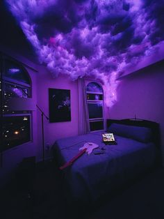 a bedroom with purple clouds in the ceiling