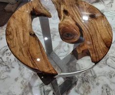 a wooden horse head on top of a glass table