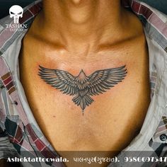 a close up of a person's chest with a tattoo design on the chest