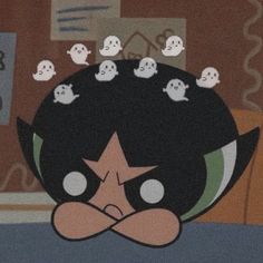 an animated character with many ghost heads on his head