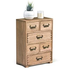 a wooden dresser with drawers and a potted plant sitting on it's top