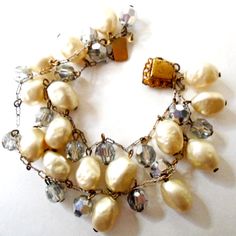 50's Pearl Chain Bracelet, AB Bead Freshwater Pearl Chain Bracelet, Two Strand AB Bead Freshwater Pearl Bracelet This freshwater pearl and AB bead, two strand, gold tone chain bracelet. Measures 6.5" in length clasp closer.  VERY GOOD VINTAGE CONDITION  Please remember vintage goodies are NOT new. Each carry some trace of those who have loved and enjoyed them in the past. Purchase constitutes reading of shop policies. Thank you. BUY 3 SHIPS FREE! Purchase any 3 jewelry items and your shipping wi Vintage Beaded Wedding Bracelets, Vintage Pearl Bracelet With Round Beads For Wedding, Adjustable Vintage Beaded Bracelet For Wedding, Vintage Pearl Bracelets For Parties, Vintage Gold Pearl Bracelet With Round Beads, Vintage Beaded Bracelets For Wedding, Gold Vintage Pearl Beaded Bracelet, Vintage Adjustable Beaded Bracelet With Lobster Clasp, Vintage Pearl Bracelet With Round Beads For Gift