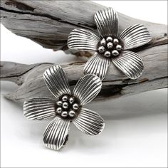 Hill Tribe Silver flower pendant measures 30mm around. All measurements do not include ring. Due to the nature of the handmade process, sizes can vary slightly. Always check sizes! Package of 1. ABOUT HILL TRIBE SILVER Each bead, pendant and toggle is handmade by the Karen Hill Tribe people using traditional ancient methods passed down for generations. Their kind and gentle spirit makes their silver extra special. Each piece is individually crafted; therefore, the designs and weights will vary s Handmade Flower-shaped Silver Jewelry, Silver Flower Jewelry With Handmade Flowers, Nickel Free Nature-inspired Flower Earrings, Nickel-free Flower Shaped Ring, Gentle Spirit, Hill Tribe Silver, Bead Pendant, Silver Flowers, Flower Pendant