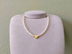 Freshwater Pearl Gold Heart Necklace, Natural White Pearl, High Luster Pearls, Heart, Genuine Pearl Beaded Necklace D E T A I L * Length: approx. 16 inches, non-adjustable * Pearl size: approx. 4x5mm * Materials: Freshwater cultured pearls, gold plated heart bead and clasp * Pearl Color: Natural white Please reassure the size and length before you place an order. This item is sold as it is; if you would like to have a specific length you need, please message us then we will get back to you with Pearl Necklace With Heart-shaped Beads, Heart-shaped Pearl Necklace, Beaded Pearl Necklace For Valentine's Day, White Pearl Necklace With Round Beads For Mother's Day, Pearl Necklace With Heart Shaped Beads And Round Beads, Pearl Necklace With Heart And Round Beads, Elegant Pearl Necklace With Heart Shaped Beads, Pearl Necklace As Valentine's Day Gift, Pearl Necklace As A Valentine's Day Gift