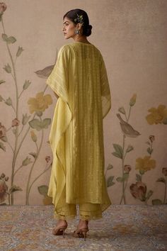 Lemon yellow kaftan with thread, sequin and floral embroidery. Comes with cotton pant with lace detailing and a slip. - Aza Fashions Spring Yellow Palazzo Set With Resham Embroidery, Spring Yellow Chanderi Anarkali Set, Yellow Palazzo Set With Zari Work For Spring, Yellow Anarkali Set For Spring, Yellow Chikankari Embroidery Kaftan, Yellow Sharara With Chikankari Embroidery For Spring, Yellow Bollywood Palazzo Set For Spring, Spring Yellow Anarkali Set With Chikankari Embroidery, Yellow Cotton Anarkali Set With Floral Embroidery