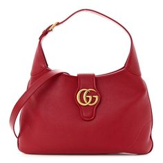 This is an authentic GUCCI Soft Goatskin Medium Aphrodite Shoulder Bag in Hibiscus Red.This classic hobo bag is crafted of red goatskin leather. The bag features astylishlooping shoulder strap and an optional, long shoulder strap. The crossover strap features a gold GG logo that opens to a red microfiber interior with a zipper pocket. Gucci Soft Leather Shoulder Bag, Chic Gucci Hobo Bag, Chic Gucci Hobo Bag With Gold-tone Hardware, Designer Gucci Hobo Bag, Chic Gucci Hobo Bag For Shopping, Gucci Soft Leather Bag For Formal Occasions, Gucci Leather Top Handle Hobo Bag, Gucci Soft Leather Rectangular Shoulder Bag, Luxury Gucci Top Handle Hobo Bag