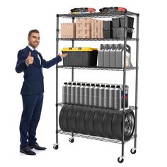 a man standing next to a metal shelf filled with tires