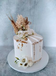 a cake decorated with flowers and an old book