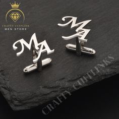 Designed with care and precision, each pair is a perfect token of affection for the groom on his wedding day. These exquisite pieces are more than just cufflinks; they're a statement of individuality and elegance. They also serve as a thoughtful gift for Dad or any special man in your life. Our Personalized Initial Cufflinks are meticulously crafted from high-quality materials, ensuring durability and a lasting shine. These cuff links feature elegant engraving, customizable with any initials. Size-wise, they strike the perfect balance - noticeable without being ostentatious, measuring at an ideal diameter to complement any dress shirt. Choose from the classic elegance of cufflinks without a box or opt for the complete package with a handsome presentation box that makes for a memorable gift Initial Cufflinks, Groom Gifts, Engraved Cufflinks, Custom Cufflinks, Groomsmen Proposal, Men Store, Groomsmen Gifts, Dad Gifts, Cufflinks Wedding