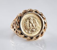 14K gold coin ring is marked 14KP, the P being for Plumb gold, a mark meaning the ring qualifies as full 14K gold purity.  The 1945 gold DOS PESOS coin is set in an open work filagree setting with rope edging around the coin.  The ring measures a ring size 6 1/2 and the face of the ring measures a bit over 5/8 inch.  The ring is solid weighing 7.6 grams and it is in great vintage condition. 5 Dollar Gold Coin Ring, Gold Coin Ring Vintage Panda, 14k Gold Coin-shaped Rings, Vintage 14k Gold Coin Ring, Gold Coin Ring, Coin Ring, Gold Coin, Gold Coins, Rings Statement